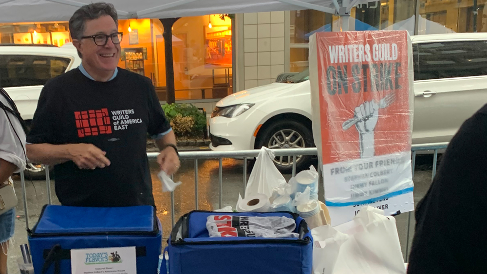 Stephen Colbert Joins Rain-Soaked NYC Rally Backing WGA, SAG-AFTRA & Animation Guild: Determined to Succeed